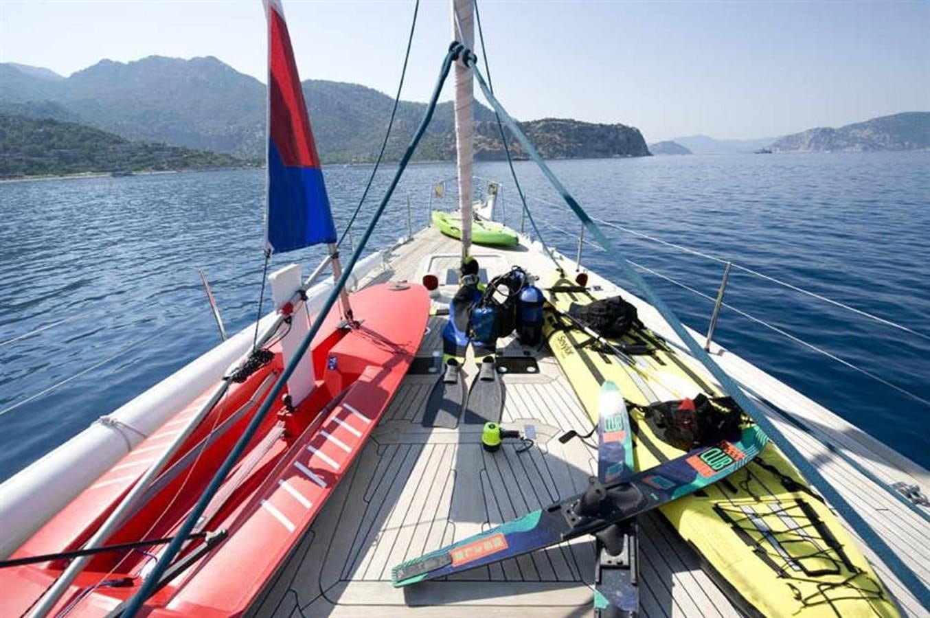 a boat with a flag on it aboard BAIURDO VI Yacht for Sale