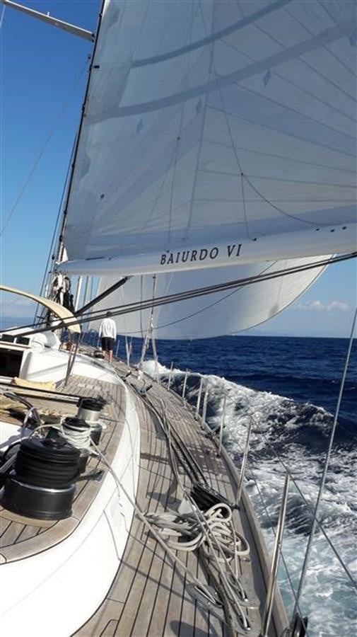 a person standing on a sailboat aboard BAIURDO VI Yacht for Sale