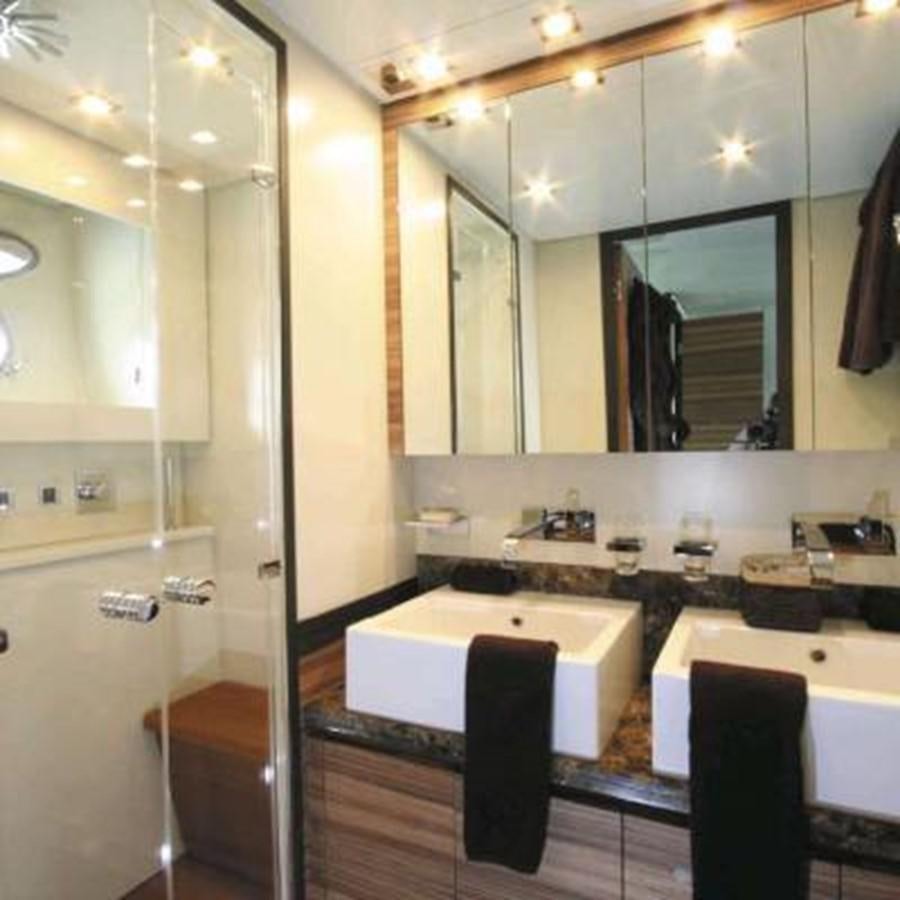 a bathroom with a large mirror aboard LEOPARD Yacht for Sale