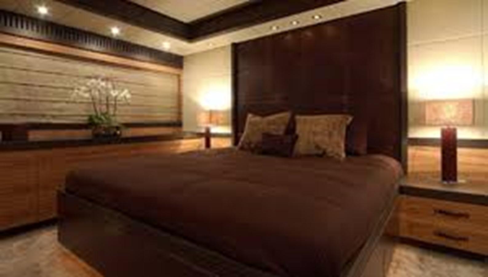 a bed in a room aboard LEOPARD Yacht for Sale