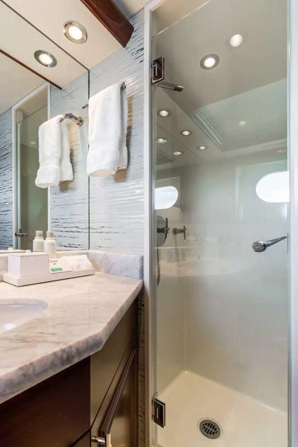 a bathroom with a large mirror aboard OUR HERITAGE Yacht for Sale