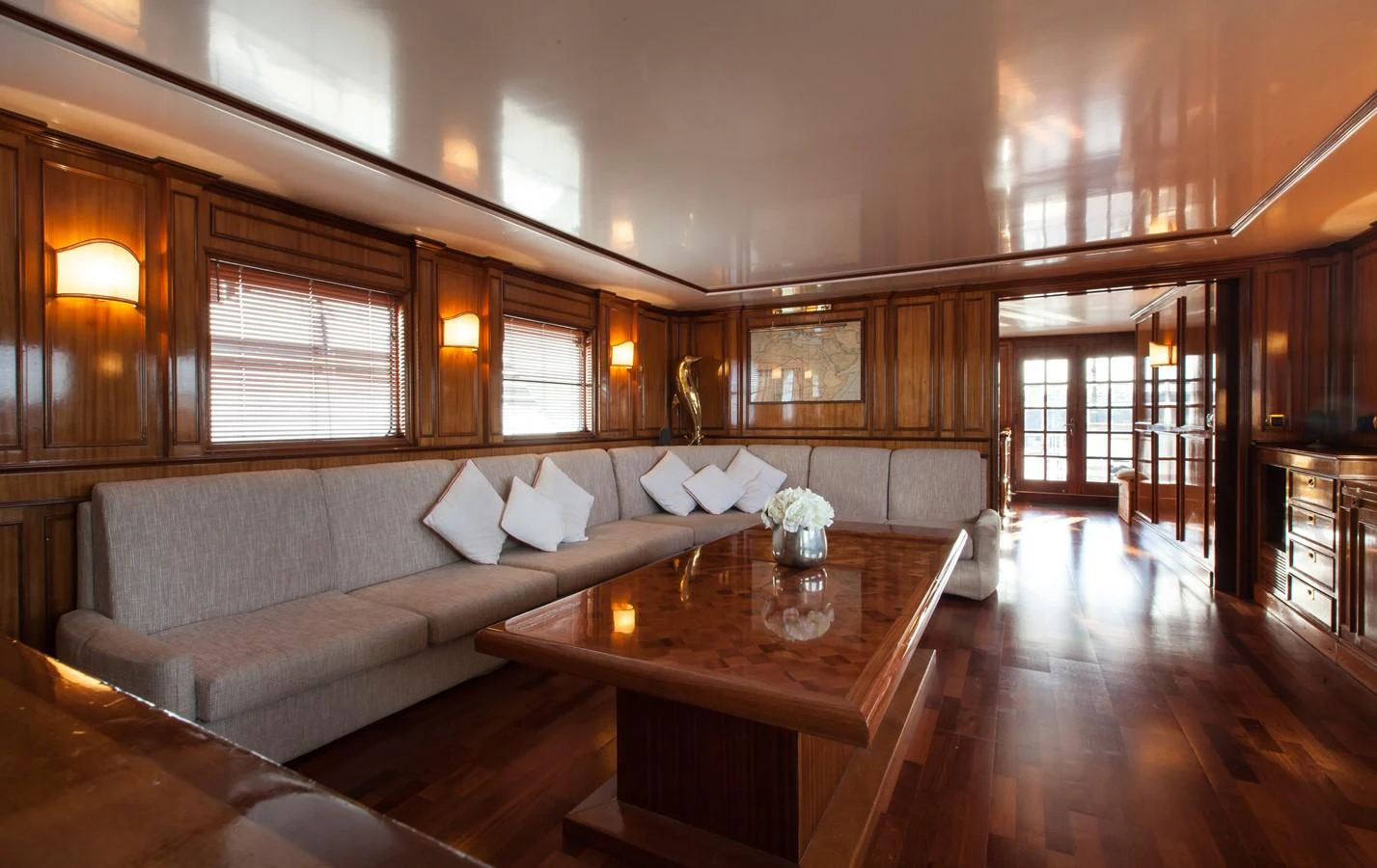 a living room with a couch and a table aboard ANTARES OF BRITAIN Yacht for Sale