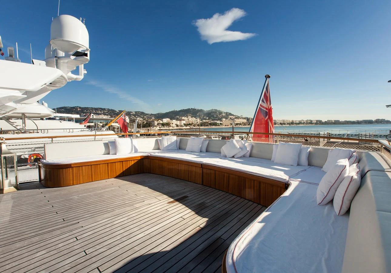 a deck with a sailboat on it and a red sailboat on it aboard ANTARES OF BRITAIN Yacht for Sale