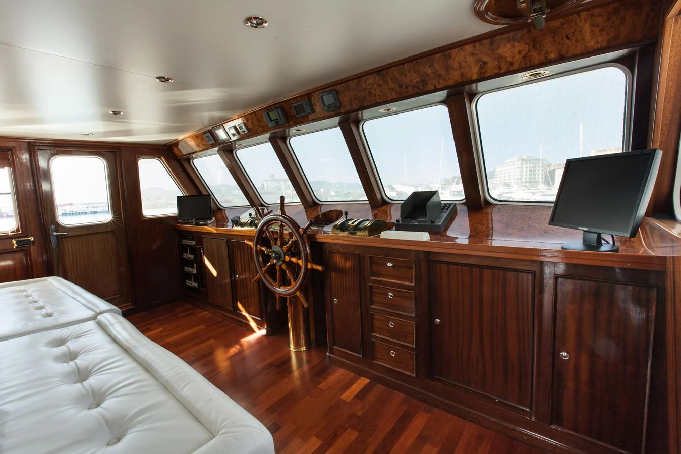 a bedroom with a bed and a desk aboard ANTARES OF BRITAIN Yacht for Sale