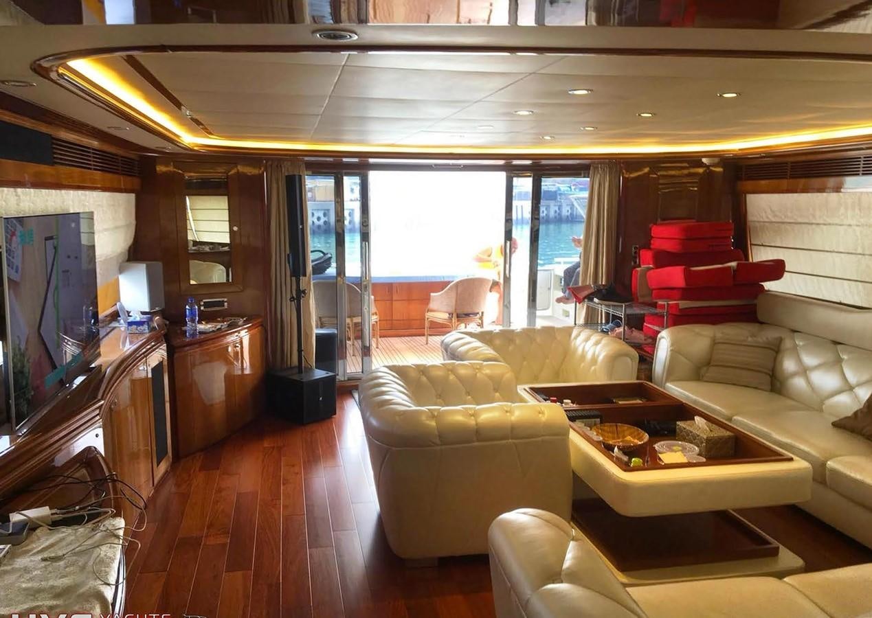 a living room with a large window aboard FERRETTI CUSTOM LINE 112 Yacht for Sale
