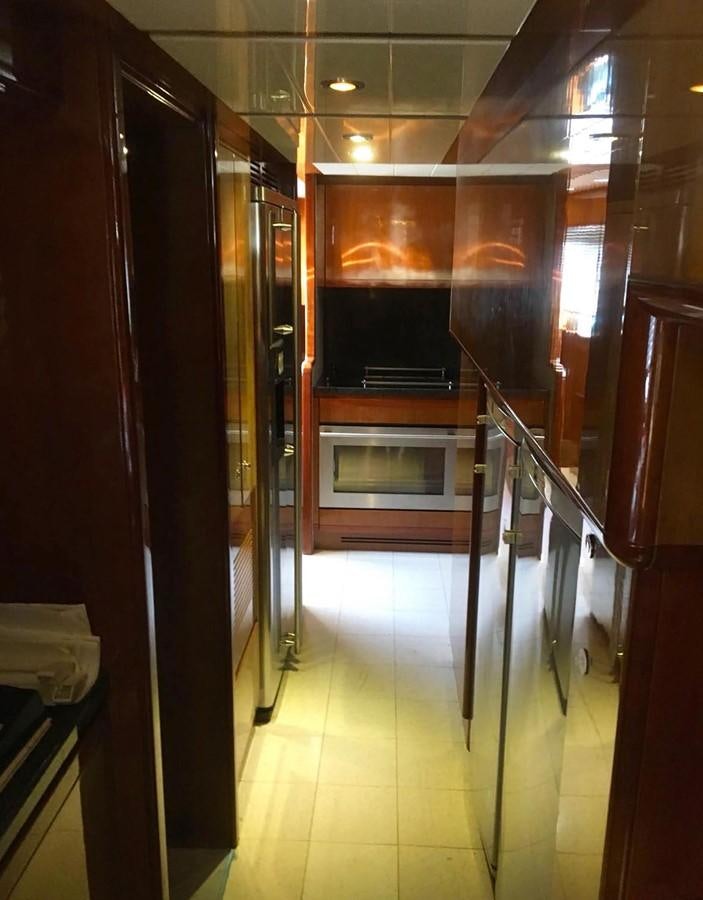 a large kitchen with stainless steel appliances aboard FERRETTI CUSTOM LINE 112 Yacht for Sale