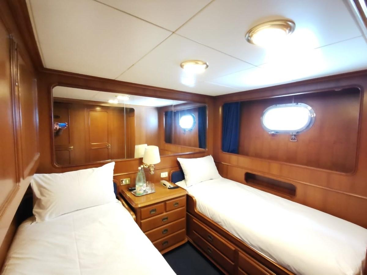 a room with two beds aboard BEL AMI II Yacht for Sale