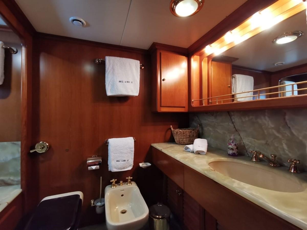 a bathroom with a sink and a toilet aboard BEL AMI II Yacht for Sale