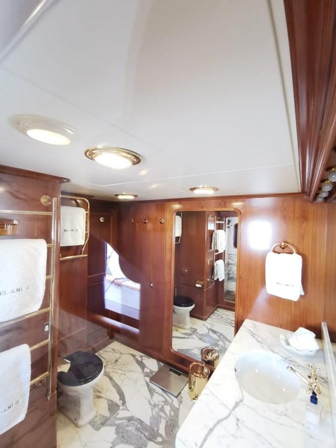 a bathroom with a tub sink and toilet aboard BEL AMI II Yacht for Sale