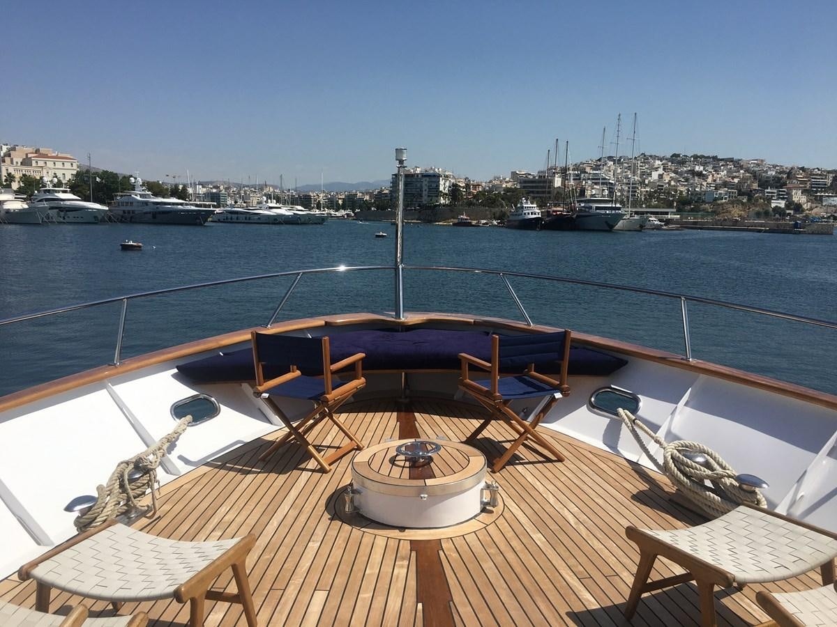 a deck with a view of a city and water aboard BEL AMI II Yacht for Sale