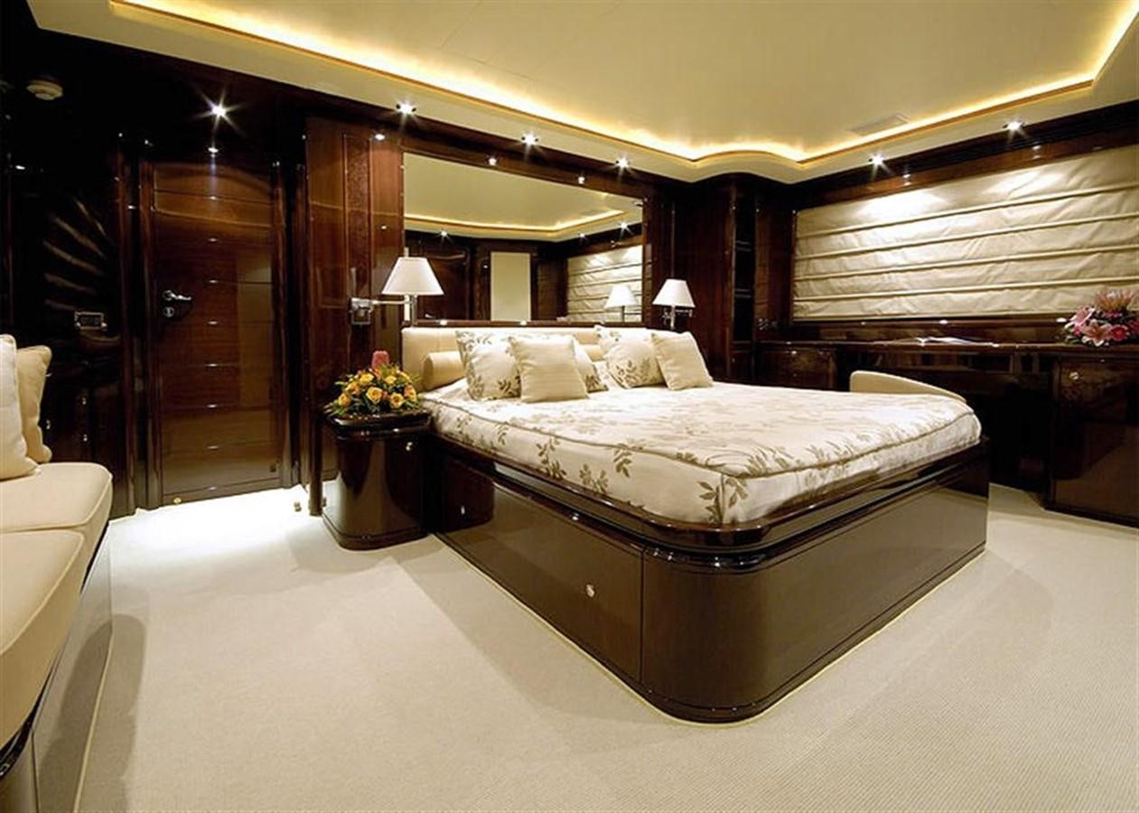 a large bedroom with a large bed aboard TWO KAY Yacht for Sale