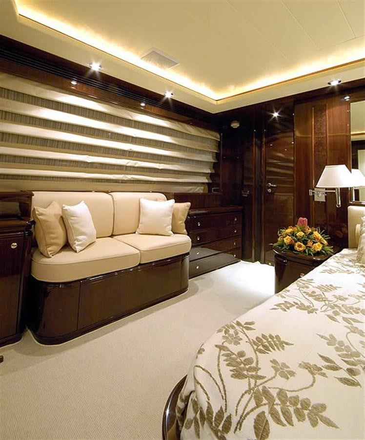 a bedroom with a bed and a desk aboard TWO KAY Yacht for Sale