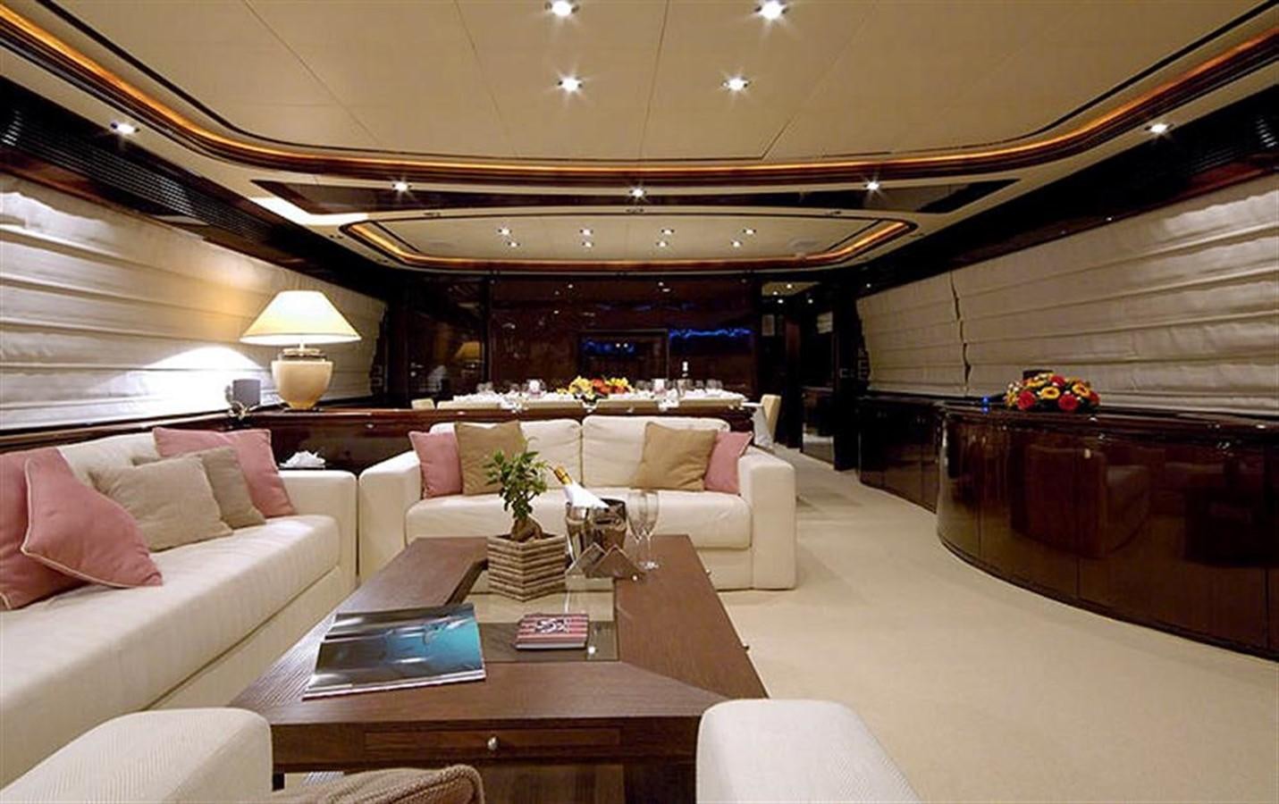 a living room with a large chandelier aboard TWO KAY Yacht for Sale