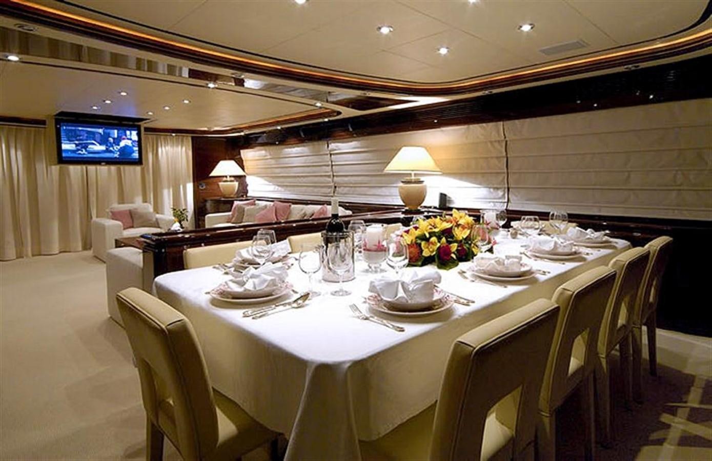 a room with a table and chairs aboard TWO KAY Yacht for Sale