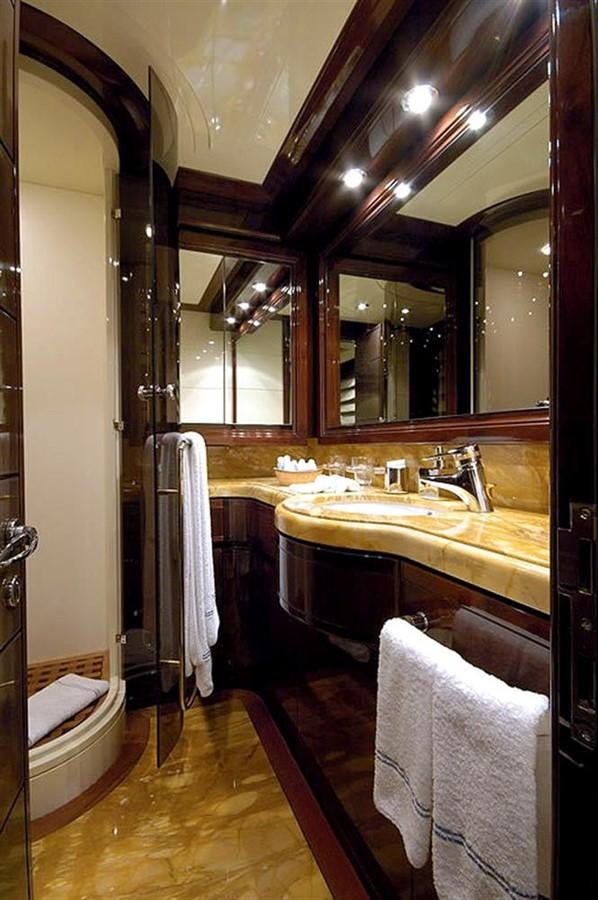 a bathroom with a large mirror aboard TWO KAY Yacht for Sale