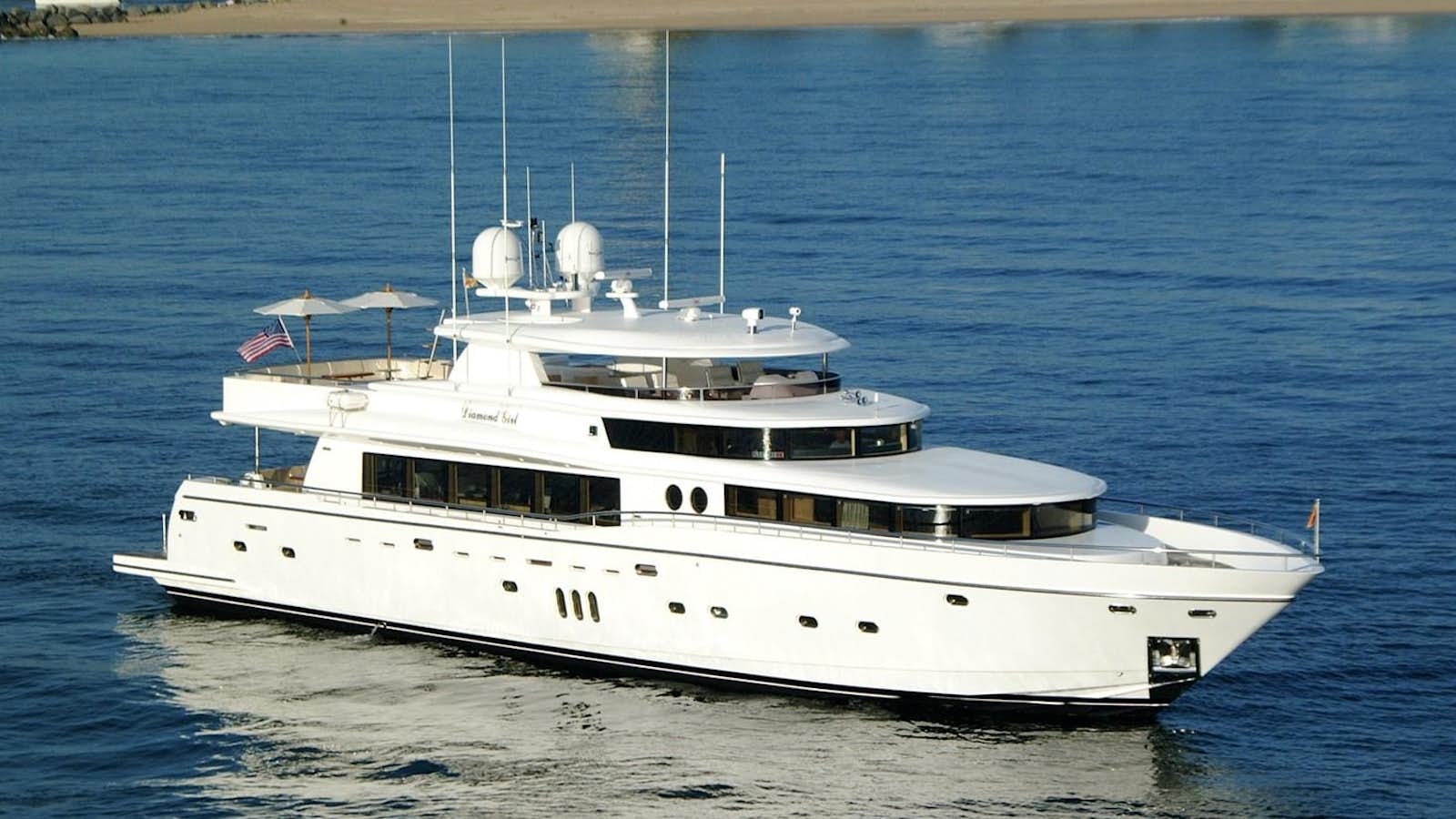 a white boat on the water aboard JOHNSON 110 SKYLOUNGE Yacht for Sale