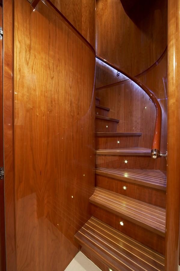 a wooden door with a metal handle aboard JOHNSON 110 FLYBRIDGE Yacht for Charter