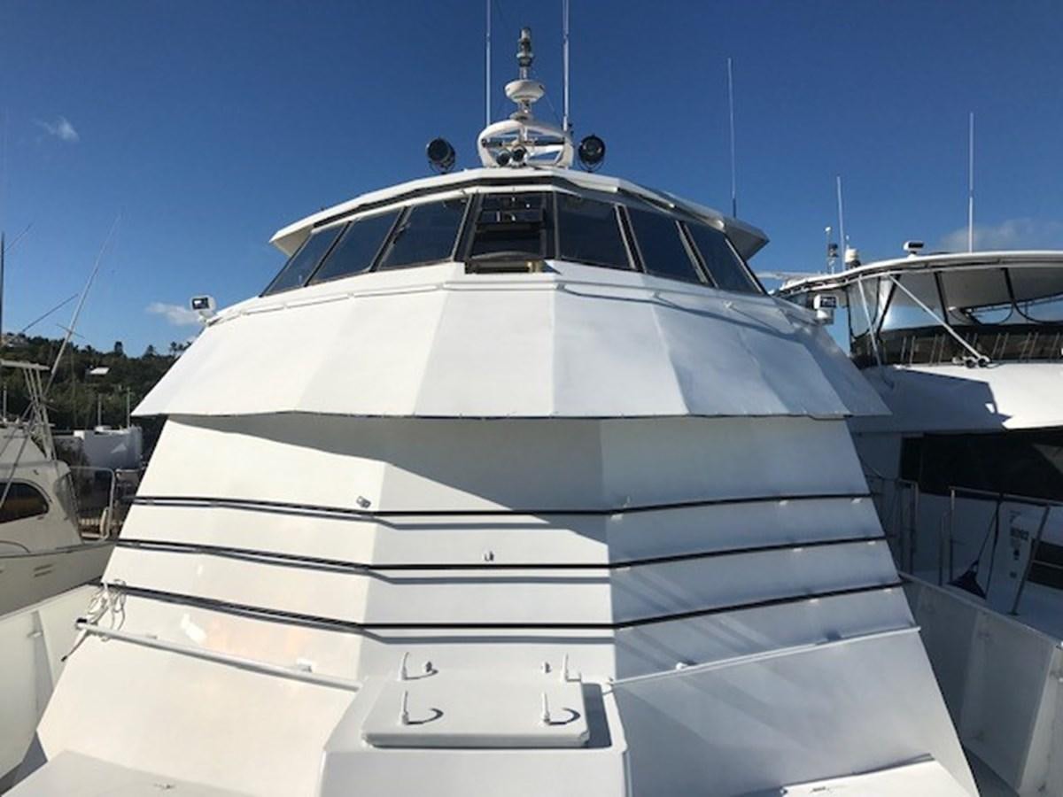 a white yacht in a harbor aboard LADY TAMARA Yacht for Sale