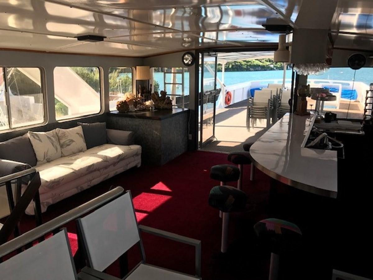 a train with a couch and a table aboard LADY TAMARA Yacht for Sale