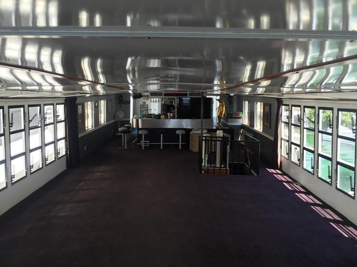 a room with tables and chairs aboard LADY TAMARA Yacht for Sale