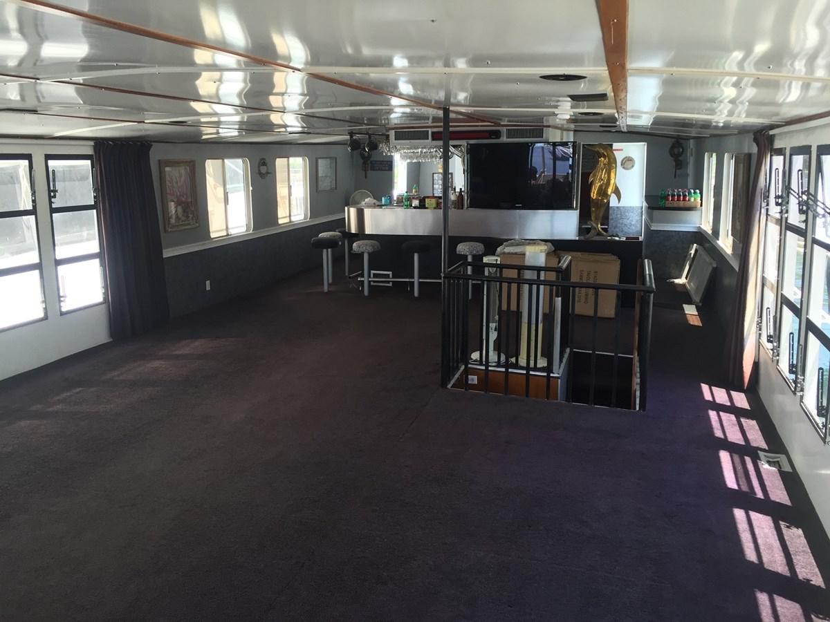 a room with a table and chairs aboard LADY TAMARA Yacht for Sale