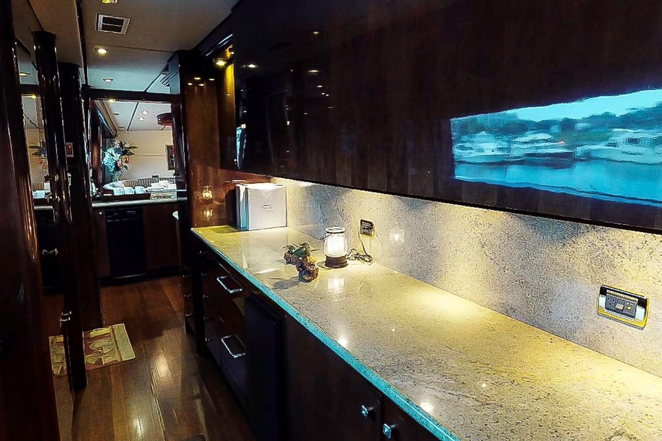a kitchen with a large island aboard IDLETYME II Yacht for Sale