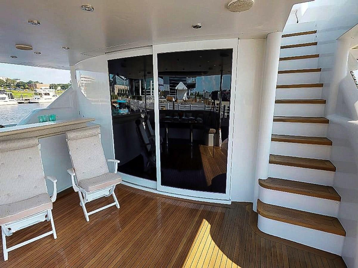 a room with a staircase and a window aboard IDLETYME II Yacht for Sale