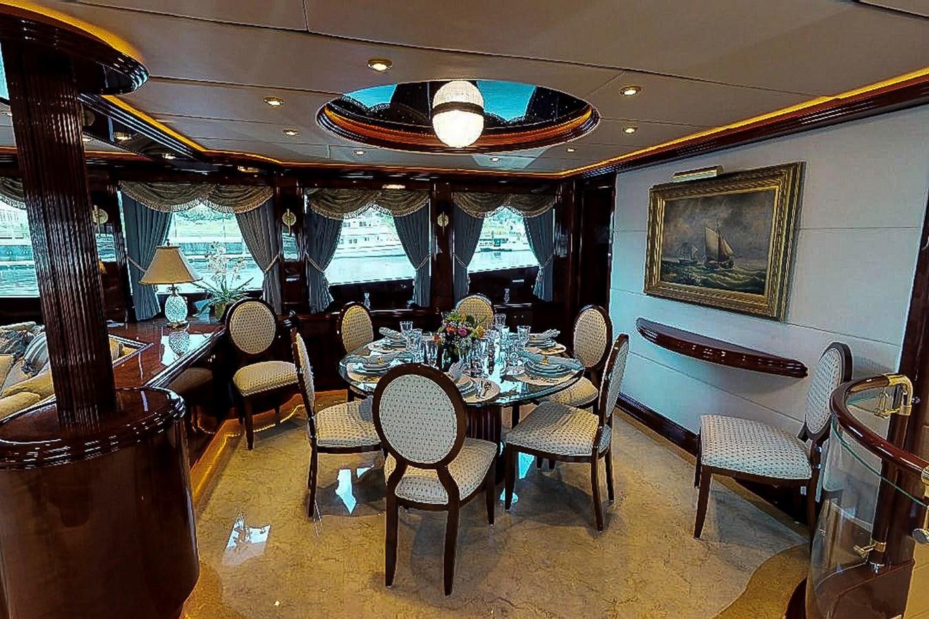 a dining room with a table and chairs aboard IDLETYME II Yacht for Sale