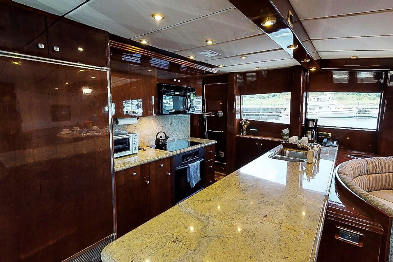 a kitchen with a large island aboard IDLETYME II Yacht for Sale