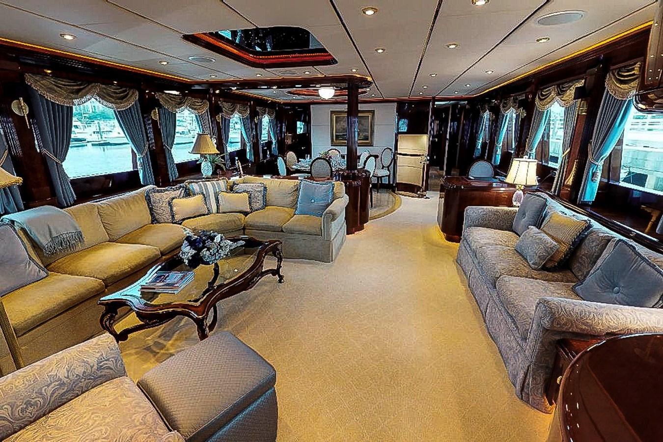 a living room with a large window aboard IDLETYME II Yacht for Sale