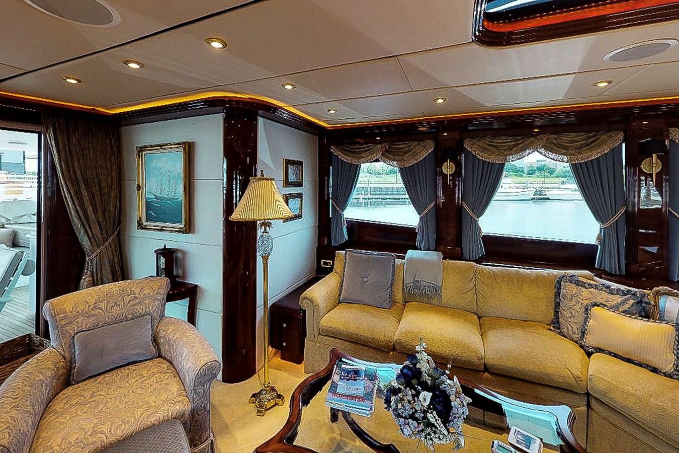 a living room with a couch and a lamp aboard IDLETYME II Yacht for Sale