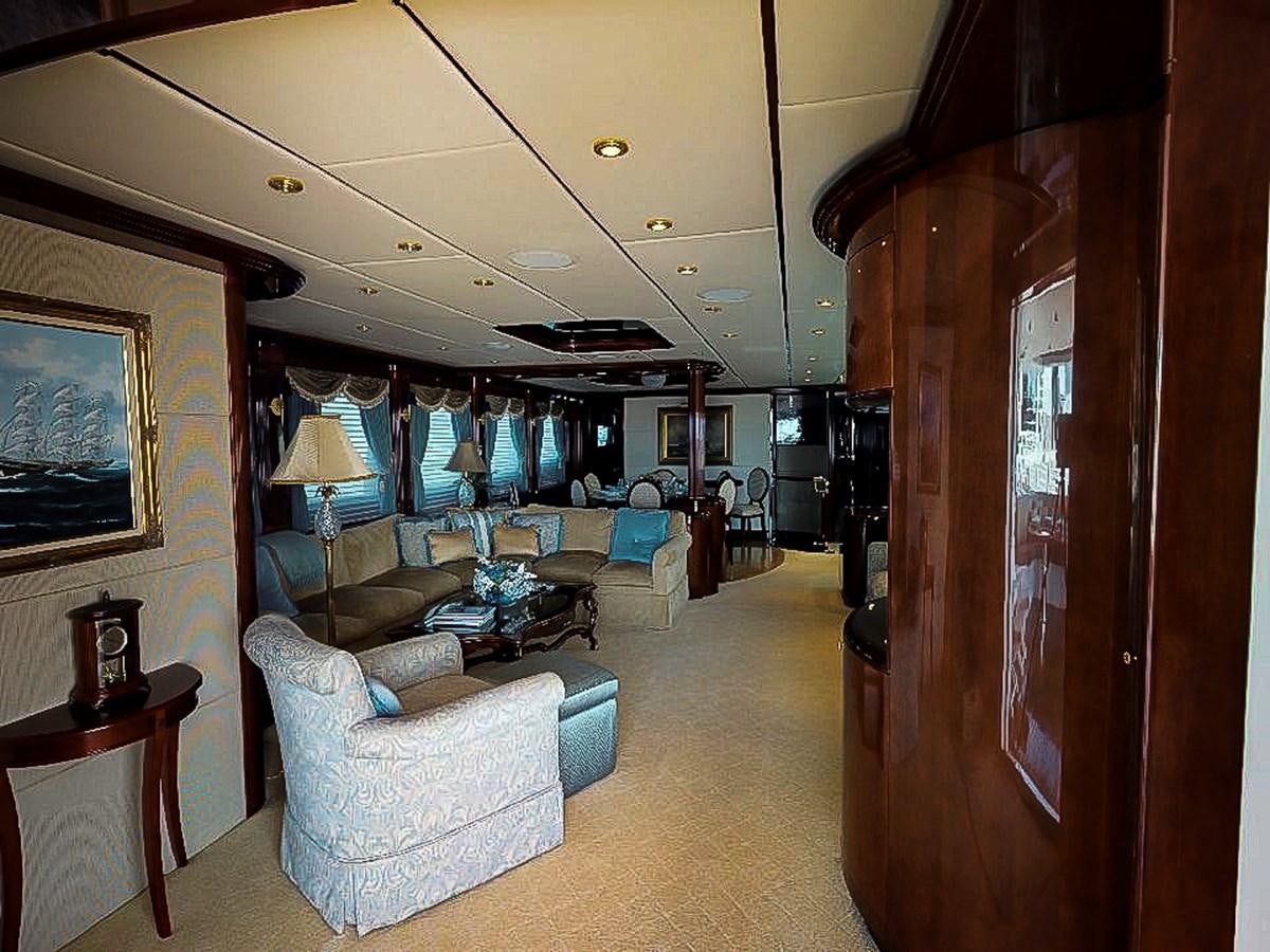 a living room with a large wood cabinet aboard IDLETYME II Yacht for Sale