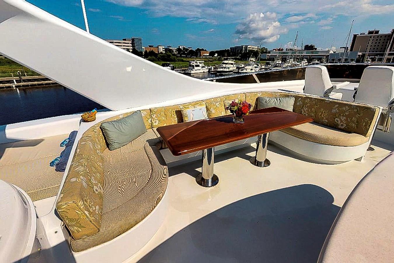 a room with a table and chairs aboard IDLETYME II Yacht for Sale
