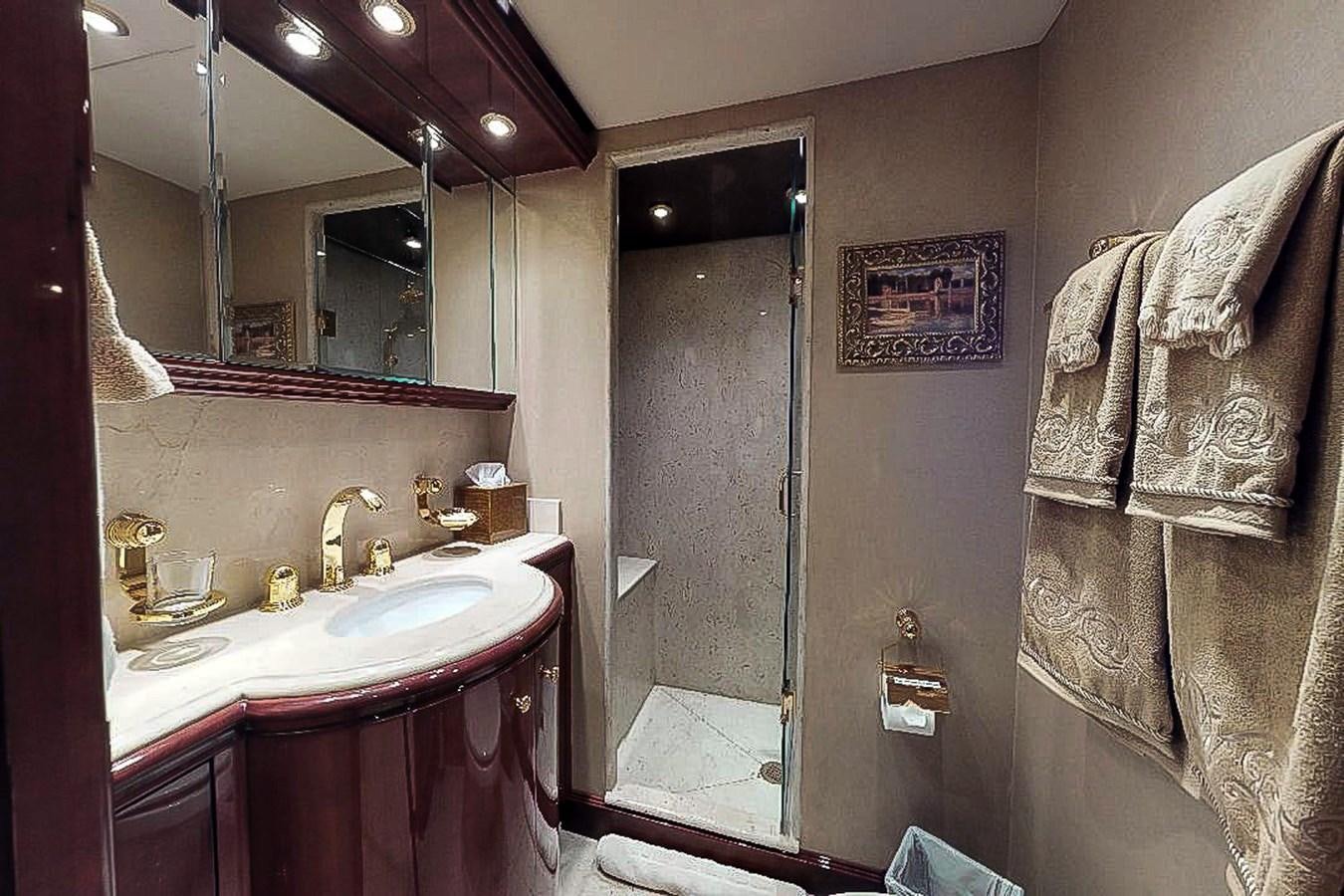 a bathroom with a sink and a mirror aboard IDLETYME II Yacht for Sale