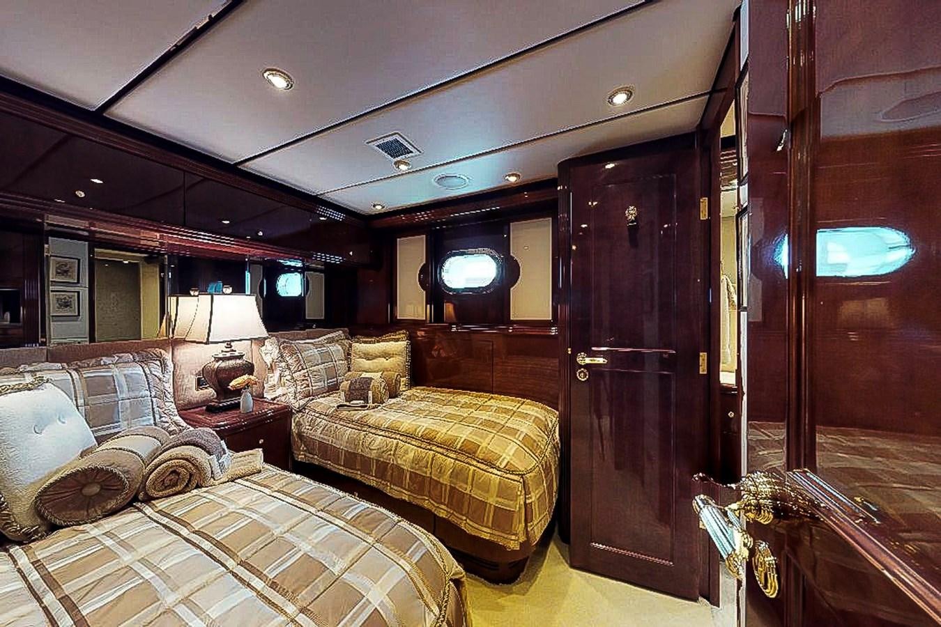 a room with a bed and a mirror aboard IDLETYME II Yacht for Sale
