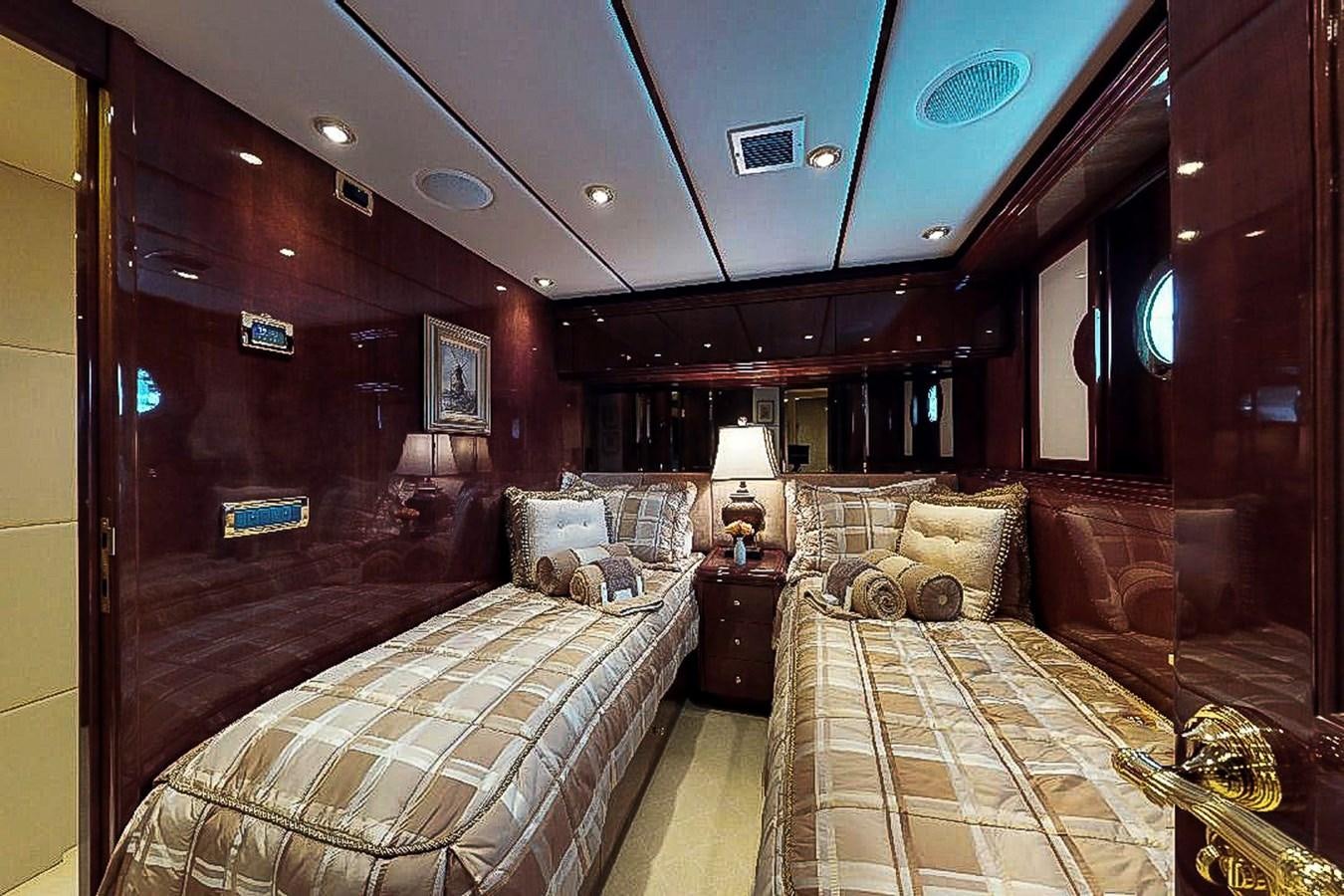 a room with a bed and a couch aboard IDLETYME II Yacht for Sale