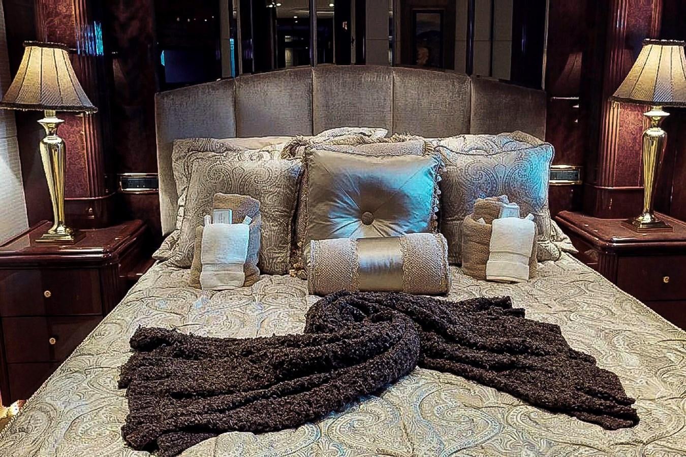 a bed with pillows and pillows aboard IDLETYME II Yacht for Sale