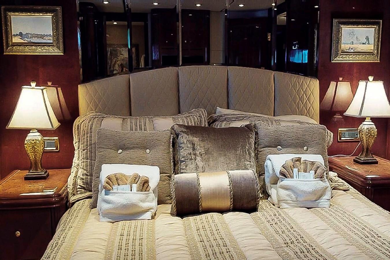a couch with a pillow and a chair in a room aboard IDLETYME II Yacht for Sale