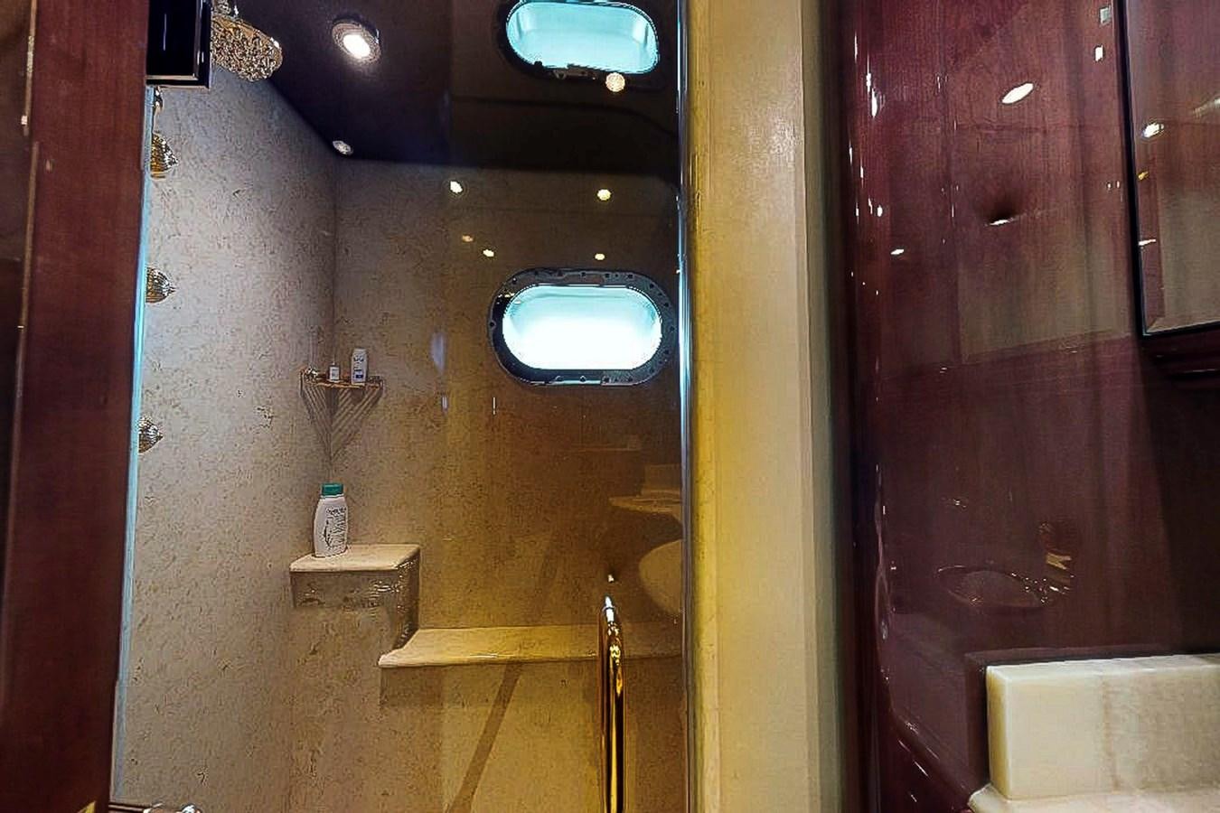 a bathroom with a large mirror aboard IDLETYME II Yacht for Sale