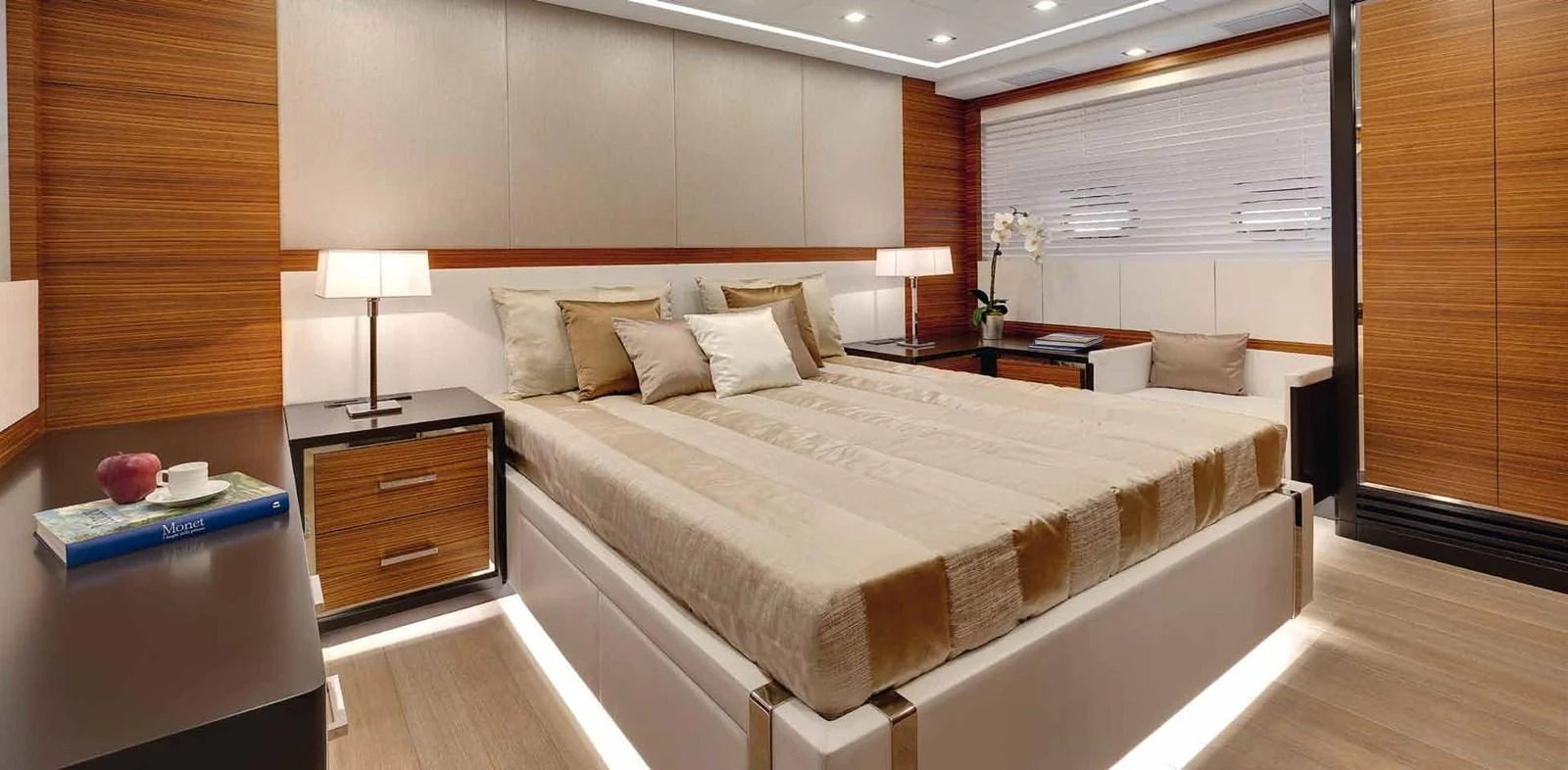 a large bed in a hotel room aboard AXTANA Yacht for Sale