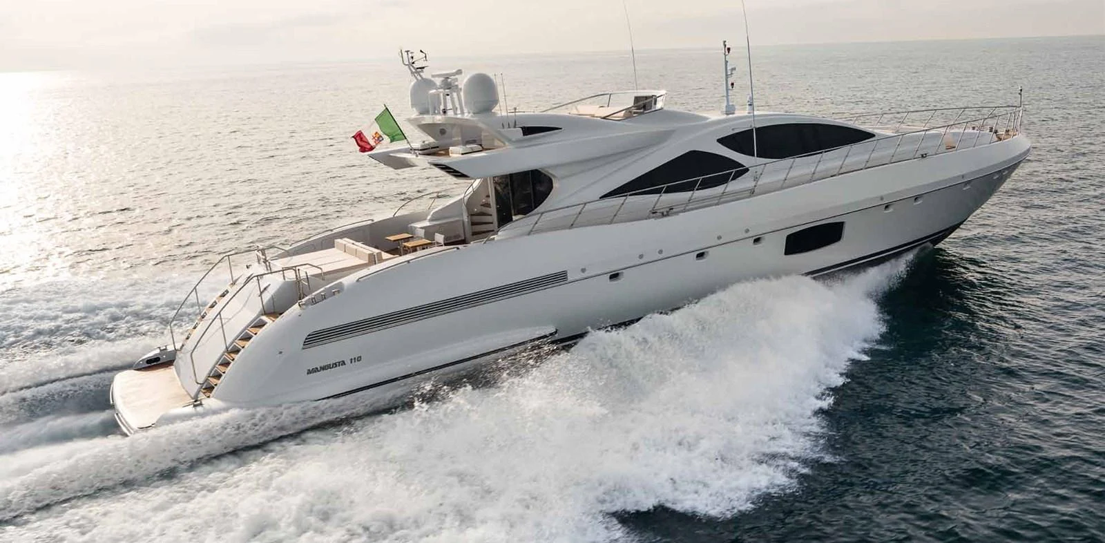 a white yacht on the water aboard AXTANA Yacht for Sale
