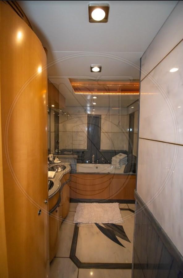 a bathroom with a large mirror aboard ANGELE Yacht for Sale