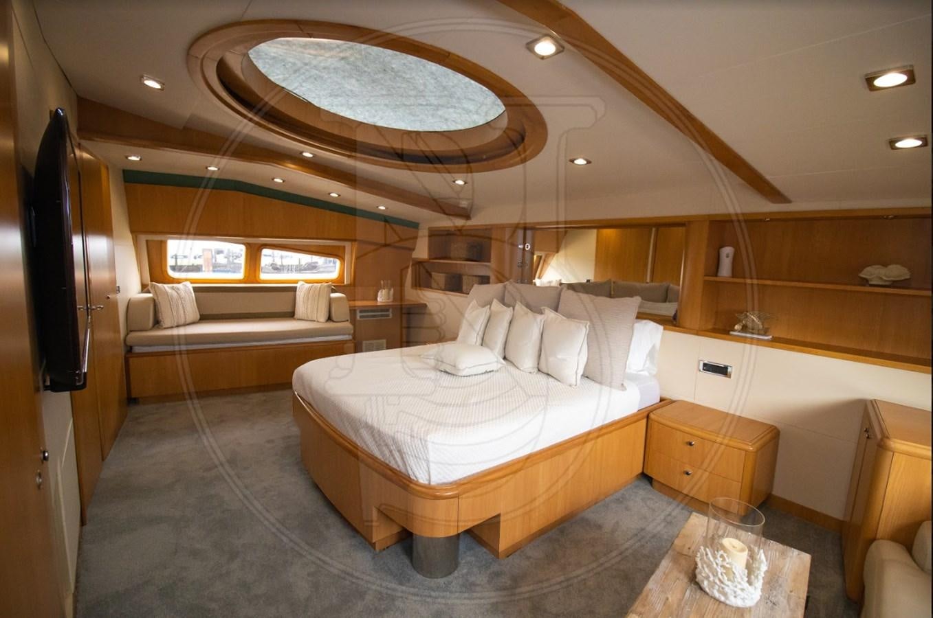a room with a bed and a television aboard ANGELE Yacht for Sale