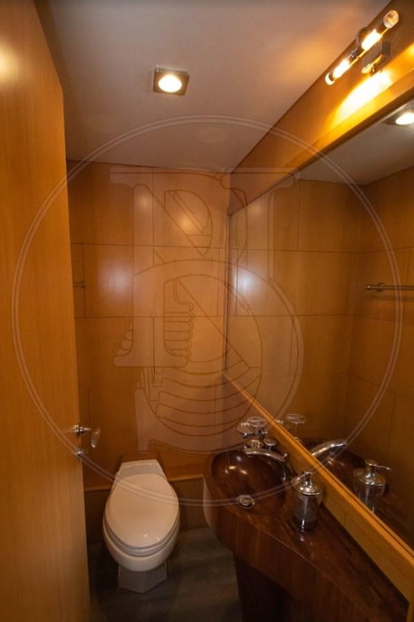 a bathroom with a toilet and a large shower aboard ANGELE Yacht for Sale