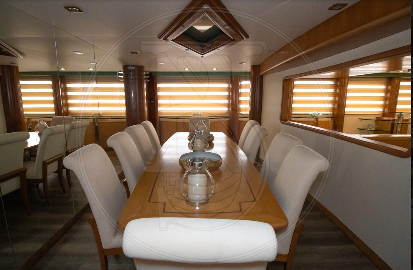a dining table in a room aboard ANGELE Yacht for Sale