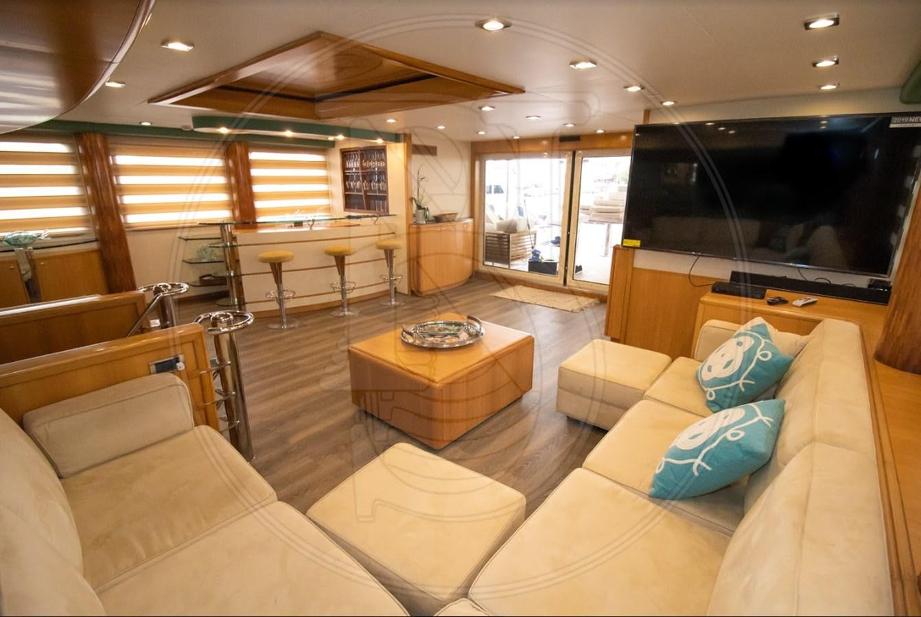 a living room with a large screen aboard ANGELE Yacht for Sale