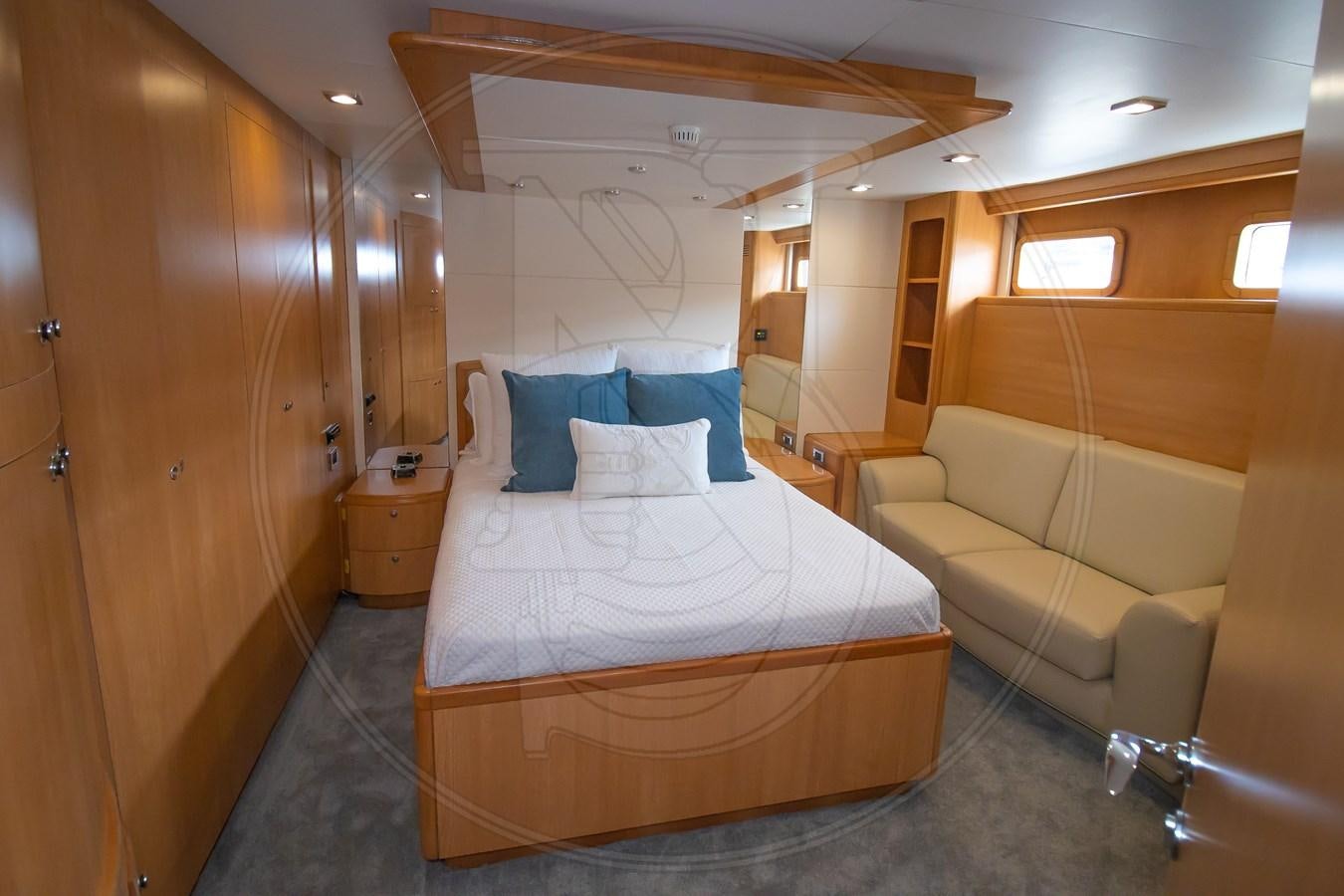 a room with a bed and a couch aboard ANGELE Yacht for Sale