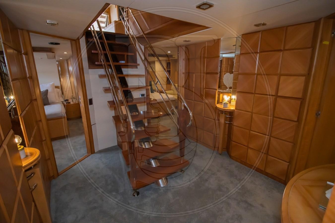 a room with a staircase and a wood staircase aboard ANGELE Yacht for Sale