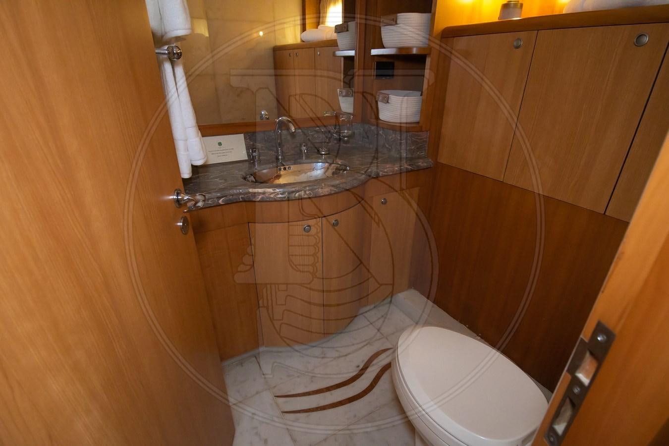 a bathroom with a sink and toilet aboard ANGELE Yacht for Sale