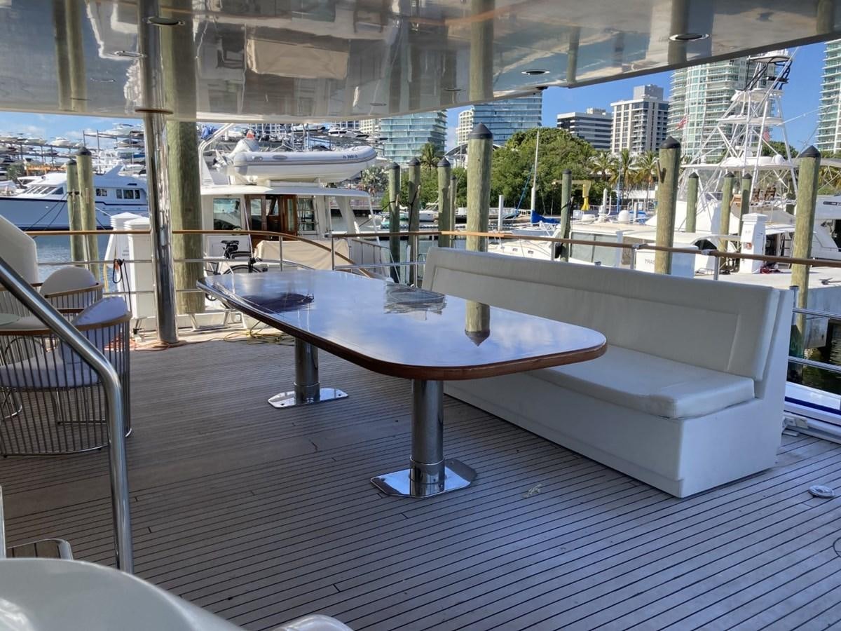 a table and chairs on a deck aboard ANGELE Yacht for Sale